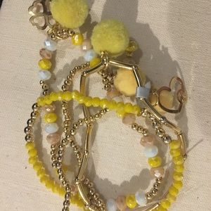 Multiple yellow bracelets